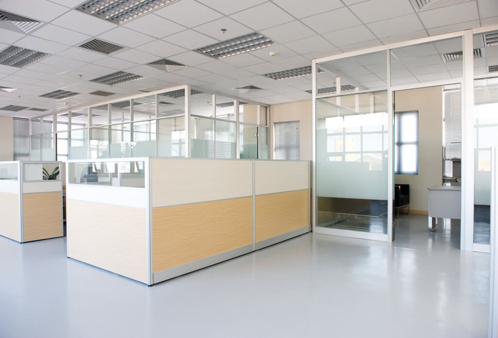 Corporate office settings showing desks, cubicles and files.